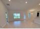 Open concept living area with tile flooring, recessed lighting, and backyard views at 11503 Sw 65Th Avenue Rd, Ocala, FL 34476