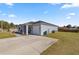 Front view of house with spacious driveway at 12803 Sw 73Rd Ter, Ocala, FL 34473