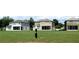 View of multiple homes with green lawns at 4085 Sw 49Th Ave, Ocala, FL 34474