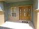 Elegant front door with decorative glass panes and sidelights provides a welcoming entrance at 4085 Sw 49Th Ave, Ocala, FL 34474