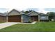 Charming single-story home featuring a well-maintained lawn and attached two car garage at 4085 Sw 49Th Ave, Ocala, FL 34474