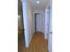 Hallway with hardwood floors leading to bedrooms and bathrooms at 4085 Sw 49Th Ave, Ocala, FL 34474