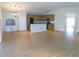 Open kitchen with wood cabinetry, stainless steel appliances, breakfast bar, and adjacent dining area at 4085 Sw 49Th Ave, Ocala, FL 34474