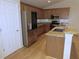 Well-lit kitchen featuring wood cabinets, granite countertops, and a stainless steel refrigerator at 4085 Sw 49Th Ave, Ocala, FL 34474