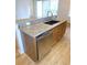 Kitchen island with stainless steel dishwasher, granite countertops, and wood cabinets at 4085 Sw 49Th Ave, Ocala, FL 34474