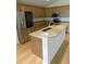 Kitchen features include wood cabinets, granite countertops, stainless steel appliances and a kitchen island at 4085 Sw 49Th Ave, Ocala, FL 34474