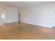 Open-concept living area with wood flooring, neutral paint, and access to multiple rooms at 4085 Sw 49Th Ave, Ocala, FL 34474
