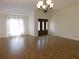 Spacious living room with hardwood flooring is perfect for entertaining and relaxing at 4085 Sw 49Th Ave, Ocala, FL 34474
