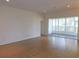 Spacious living room with wood floors and sliding glass doors leading to an enclosed lanai at 4085 Sw 49Th Ave, Ocala, FL 34474