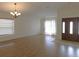 The living room is a large area with hardwood floors and a ceiling fan at 4085 Sw 49Th Ave, Ocala, FL 34474