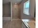 Bright bathroom featuring a separate tiled shower and soaking tub with modern fixtures at 7605 Sw 103Rd Loop, Ocala, FL 34476