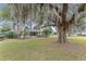 Spacious backyard with large oak tree and grassy lawn at 8718 Sw 83Rd Loop, Ocala, FL 34481