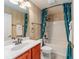 Bathroom with tub, shower, and teal shower curtain at 8718 Sw 83Rd Loop, Ocala, FL 34481