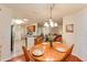 Kitchen and dining area with wood table and chairs, offering an open floor plan at 8718 Sw 83Rd Loop, Ocala, FL 34481