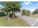 Home exterior showcasing a white garage door and brick driveway at 8718 Sw 83Rd Loop, Ocala, FL 34481