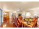 Open concept living room with leather furniture and a view into the kitchen and dining area at 8718 Sw 83Rd Loop, Ocala, FL 34481