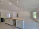 Bright kitchen features granite counters, modern appliances and flows to large room at 9679 Sw 46Th Ct, Ocala, FL 34476