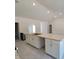 Bright kitchen features granite counters, modern appliances and flows to large room at 9679 Sw 46Th Ct, Ocala, FL 34476
