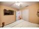 Bedroom with large TV, ceiling fan, and double bed at 16690 Sw 50Th Ave, Ocala, FL 34473