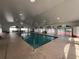 Bright indoor swimming pool with ample natural light and high ceilings at 5065 Nw 21St Loop, Ocala, FL 34482