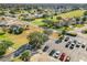 Aerial view of community, showcasing a parking lot and surrounding homes at 5226 Nw 21St Loop, Ocala, FL 34482