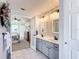 Double vanity bathroom with access to bedroom and updated finishes at 5226 Nw 21St Loop, Ocala, FL 34482