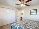 Second bedroom with double-door closet and ceiling fan at 5226 Nw 21St Loop, Ocala, FL 34482