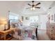 Spacious bedroom with ceiling fan, ample natural light, and wood furniture at 5226 Nw 21St Loop, Ocala, FL 34482