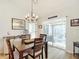 Charming dining room with a chandelier and access to a screened porch at 5226 Nw 21St Loop, Ocala, FL 34482