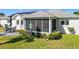 House exterior with a screened lanai and solar panels at 5226 Nw 21St Loop, Ocala, FL 34482