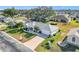 Aerial view of a single-Gathering home with a driveway and landscaped yard at 5226 Nw 21St Loop, Ocala, FL 34482