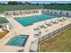 Community pool and spa with surrounding lounge chairs and tables at 5226 Nw 21St Loop, Ocala, FL 34482