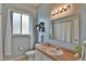 Clean bathroom with single sink vanity and shower at 5622 Nw 27Th Pl, Ocala, FL 34482