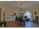 Formal dining room with hardwood floors and a chandelier at 5622 Nw 27Th Pl, Ocala, FL 34482