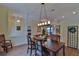 Formal dining room with hardwood floors and a chandelier at 5622 Nw 27Th Pl, Ocala, FL 34482