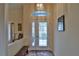 Bright entryway with a decorative glass door and a small bench at 5622 Nw 27Th Pl, Ocala, FL 34482
