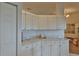White kitchen cabinets and granite countertops at 5622 Nw 27Th Pl, Ocala, FL 34482