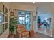 Relaxing living room area with a comfortable recliner and access to a lanai at 5622 Nw 27Th Pl, Ocala, FL 34482