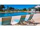 Community pool with lounge chairs and a view of the clubhouse at 5622 Nw 27Th Pl, Ocala, FL 34482