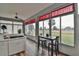 Sunroom with golf course views and dining space at 5622 Nw 27Th Pl, Ocala, FL 34482