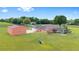 Sprawling property with a pool, fenced yard, and matching outbuilding with ample space at 9901 Nw 6Th Ct, Ocala, FL 34475