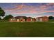 Charming single-story home featuring a lush lawn, stone accents, and a matching garage at 9901 Nw 6Th Ct, Ocala, FL 34475