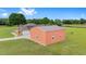 A spacious, modern barn with multiple garage doors offering ample storage and workspace on expansive property at 9901 Nw 6Th Ct, Ocala, FL 34475