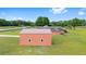 A large barn located behind the house on a beautiful countryside estate featuring a pool and ample space at 9901 Nw 6Th Ct, Ocala, FL 34475