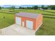 The versatile outbuilding provides ample space with two garage doors, set on lush acreage with pastures at 9901 Nw 6Th Ct, Ocala, FL 34475