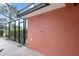 Enclosed patio with an outdoor shower installed against a stucco wall at 9901 Nw 6Th Ct, Ocala, FL 34475