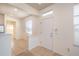 Inviting entryway featuring tile floors, a bright window above the door, and neutral-colored walls at 4950 Sw 45Th Cir, Ocala, FL 34474