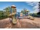 Community playground with slides and climbing structures on a wood chip surface at 4950 Sw 45Th Cir, Ocala, FL 34474