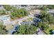 Overhead view of a single story home with an attached garage surrounded by mature trees and landscaping at 8448 Se 161St St, Summerfield, FL 34491