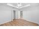 Bedroom with double door closet and laminate floors at 8448 Se 161St St, Summerfield, FL 34491